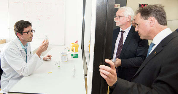 Photo (L-R): Dr Florian Lapierre, ASTech Post-doctoral Research Fellow, Dr Andrew Gooley, Chief Scientific Officer, Trajan, Hon. Greg Hunt MP, Federal Minister for Industry, Innovation and Science, Australia.